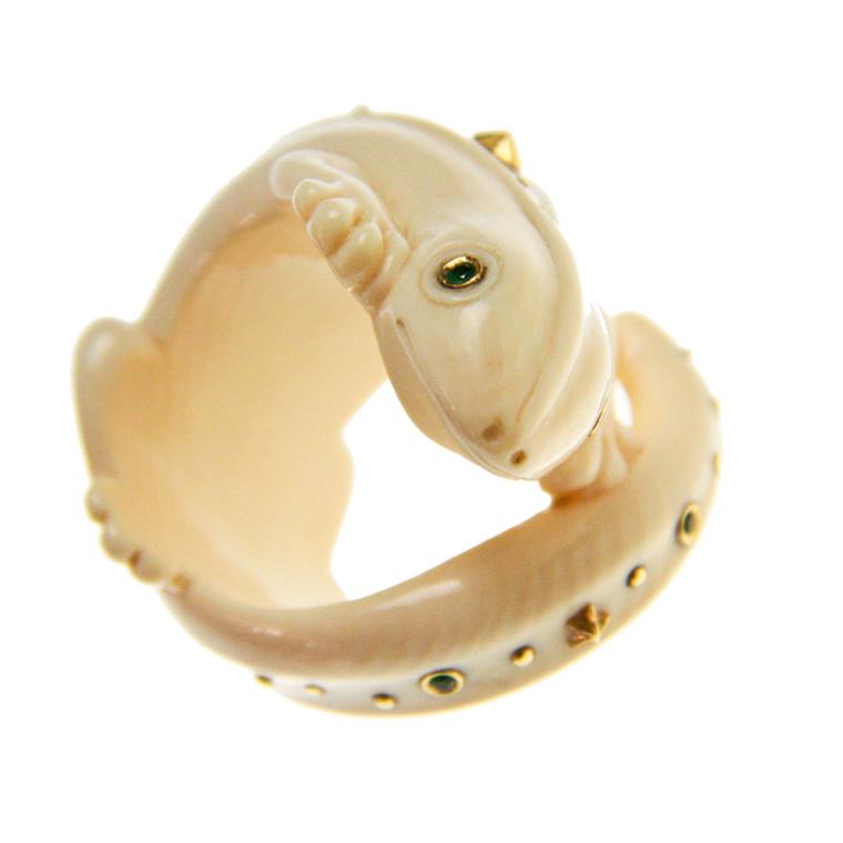 Bibi van der Velden Gecko ring made from carved woolly mammoth tooth, with yellow gold and green tsavorites.